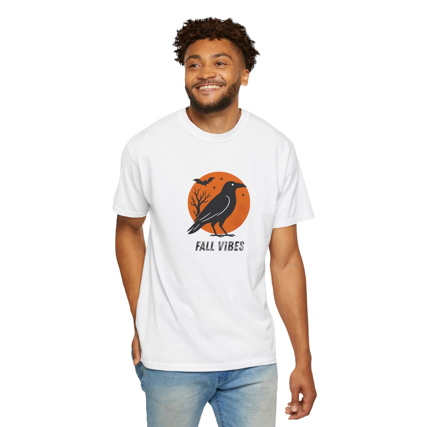 Man wearing a white t-shirt with a 'Fall Vibes' graphic design featuring a crow and moon.
