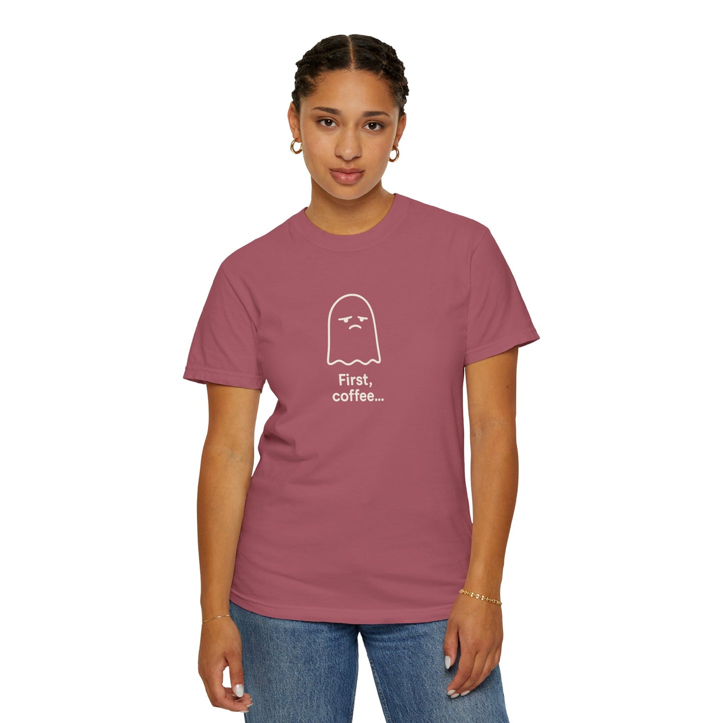 Person wearing a maroon t-shirt with a ghost graphic and text on a white background