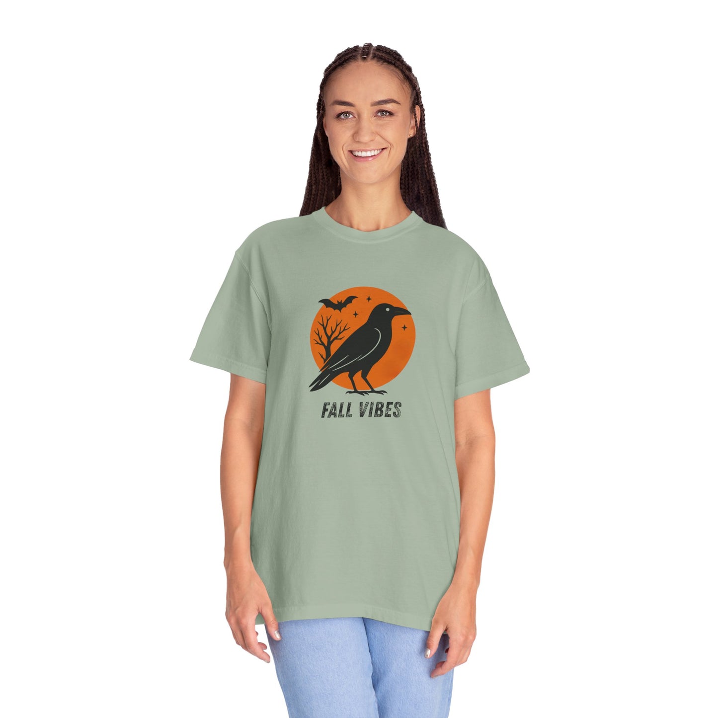 Person wearing a green t-shirt with a 'Fall Vibes' graphic design on a white background