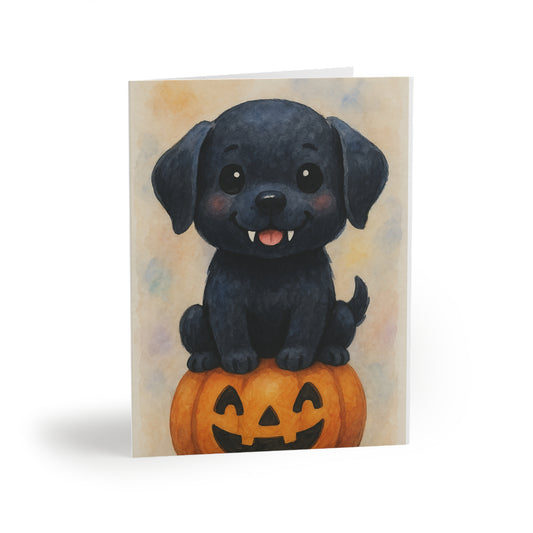 Halloween Black Labrador Puppy Greeting Card – Cute Puppy Monster on Pumpkin – Spooky Cute Monster Card for Dog Lovers