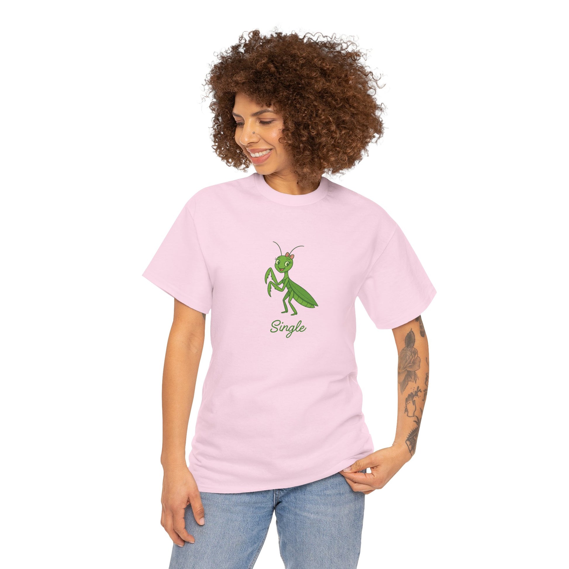 Woman wearing a pink t-shirt with a green praying mantis graphic and the word 'Single'.