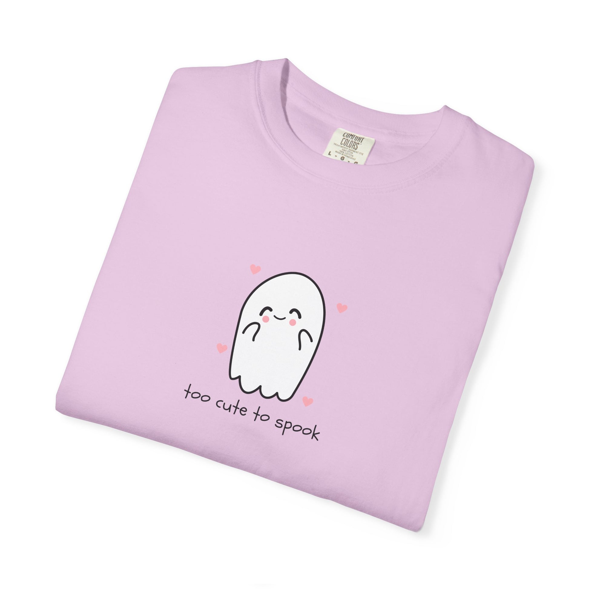 Folded light purple t-shirt with a ghost graphic and text on a white background