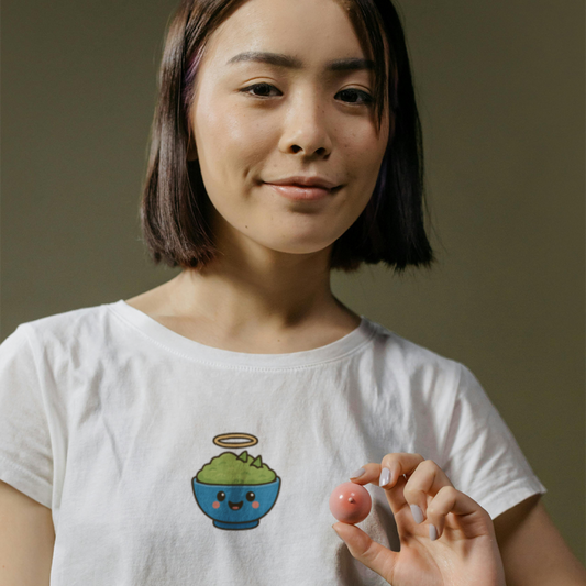 Person wearing a white t-shirt with a colorful graphic design on a plain background