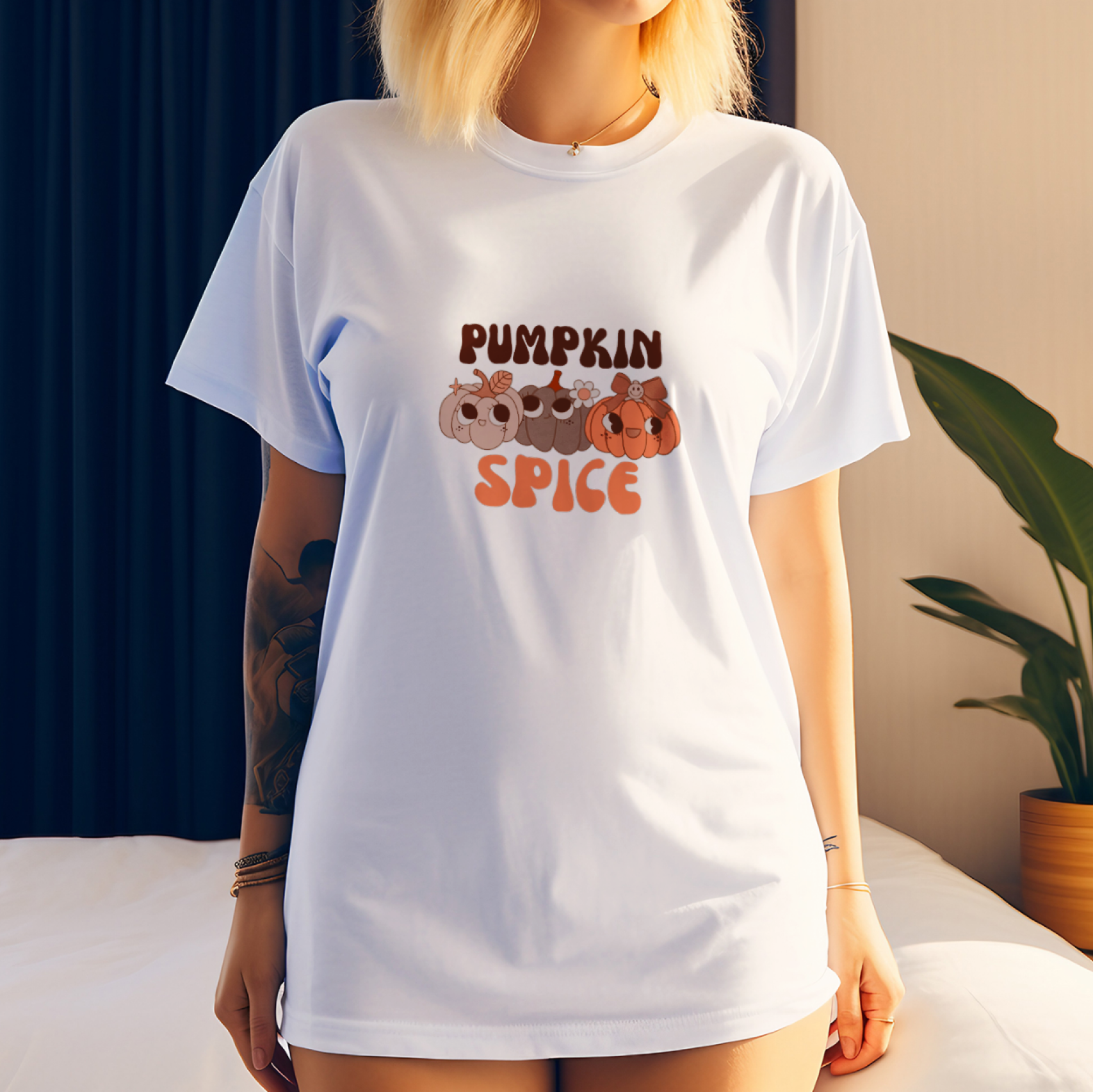Person wearing a white t-shirt with 'Pumpkin Spice' design in a casual setting.