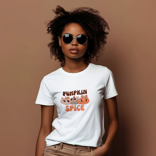 Person wearing a white t-shirt with 'Pumpkin Spice' design on a brown background